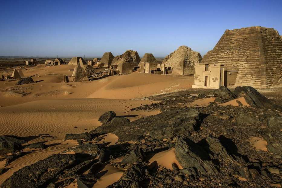 Partial view of the Meroe pyramids, which hold burial chambers for Kushite kings and queens whose rule spanned nearly five centuries from 592 BC to 350 AD, near the banks of the Nile river in an area known as Nubia in northeastern Sudan [ASHRAF SHAZLY/AFP via Getty Images]