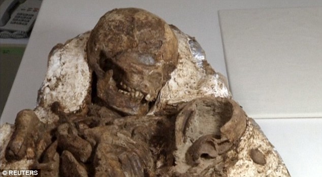 Archaeologists have uncovered the ancient remains of a young mother and an infant child locked in a 4,800-year-old embrace. The remarkable find was among 48 sets of remains unearthed from graves in Taiwan, including the fossils of five children