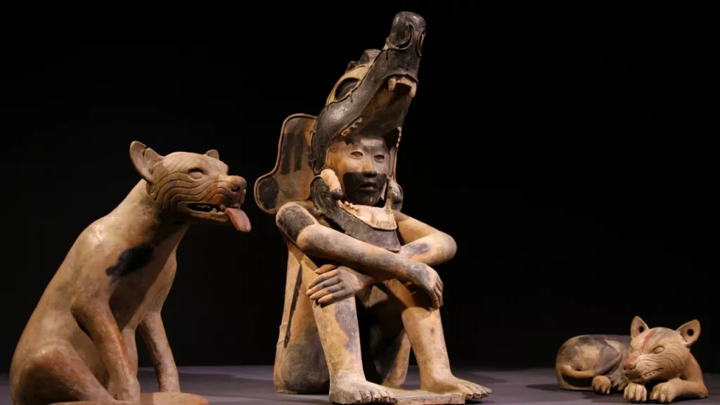 Sculpture of a Seated Man with Dogs: A Glimpse into Veracruz Culture (400–800 A.D.)